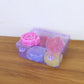 Rose shaped wax candles adding warm light to home décor and special occasions