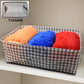 Close-up of the integrated handles on the foldable canvas storage basket, designed for comfortable carrying.