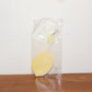 Lemon-shaped hand fan providing instant manual cooling and comfort
