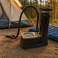 Compact and portable foot air pump from a side angle, ready for storage.
