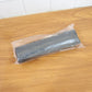 Black garbage bag roll in a retail setting, ready for purchase.