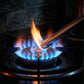 Close-up of gas stove lighter producing ignition spark