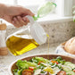 Reusable glass oil bottle with stylish green lid