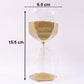 Sand flowing smoothly in glass hourglass timer