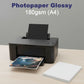 Glossy photo paper sheets showing bright vibrant color output