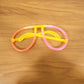 Live event with partygoers wearing glowing neon glasses