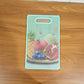 Green cutting board in kitchen setting