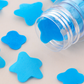 Soft, lightweight paper soap flakes packaged in a portable tube for handwashing