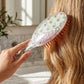 Close-up of the Soft Cushion Hair Brush highlighting its cushioned base for a soothing scalp massage.