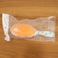Overhead view of the Soft Cushion Hair Brush, showing flexible bristles and cushioned base.