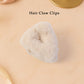 Top view of plush plastic hair claw clip showing grip design
