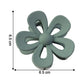 Hair clip used to hold hair back with a flower shaped design