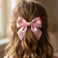 Decorative satin bow hair accessory with strong metal clip for secure hold