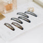 Boxed pack of non-slip snap hair clips with smooth rounded edges
