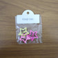Star-shaped hair clips adorning a girl's elegant braided hairstyle.