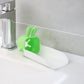 Hand demonstrating the flexible, durable silicone material of the faucet extender.