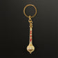 Side view of Jai Shree Ram golden metal keychain with intricate design