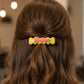 Happy bone-shaped hair clips set showcasing bright, playful accessories for kids