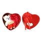 Close-up of teddy bear and scented artificial roses inside heart shaped gift box