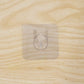 Wall hook on wooden door with transparent adhesive
