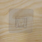 Pack of multiple transparent self-adhesive wall hooks.