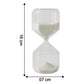Close-up of glass timer with fine white sand flowing inside for precise visual countdown