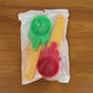 Two plastic ice cream scoops displayed neatly on a white surface.