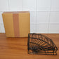 Iron shower caddy corner discreetly installed in a contemporary living space, offering utility.