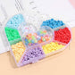 Full view of heart-shaped bead storage organizer box made from clear plastic