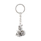 Bal Krishna Makhan Chor keychain displayed against a wooden backdrop