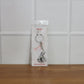 Bal Krishna Makhan Chor keychain attached to vehicle keys adding a spiritual charm