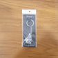 Lifestyle image of silver finish Bal Krishna keychain attached to car keys