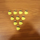 Assorted banana-shaped bag charms in set