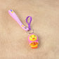 Soft rubber duck figure keychain with vibrant rainbow-themed strap