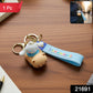 Close-up of cartoon dog keychain made of flexible silicone and durable metal ring