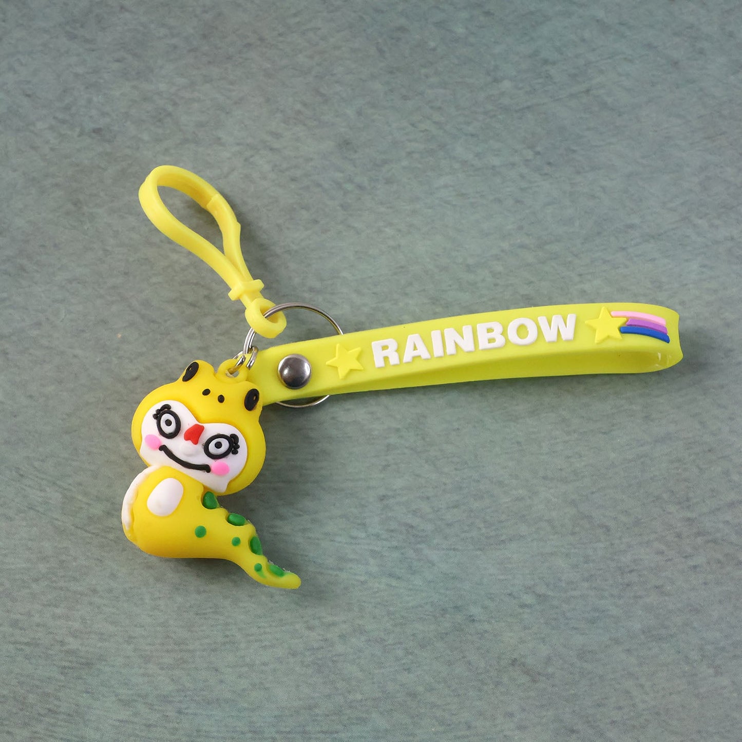 Keychain with cartoon dinosaur figure secured by metal clip hook
