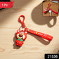 Close-up of cartoon bear figure keychain showcasing key ring and clip