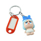 Keychain accessory featuring cartoon baby character and functional label tag.