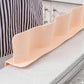 Silicone-based non-slip kitchen edge splash guard in use
