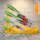 White plastic kitchen knife stand on a countertop, showcasing its bright, smooth finish.
