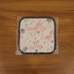 Printed heat resistant kitchen pot holder mat actively used in kitchen