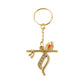 Keychain attached to keyring displaying detailed Krishna design with flute and peacock feather