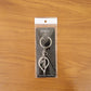 Metal Krishna symbol keychain, perfect for daily keys