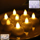 Set of round LED flameless tealight candles glowing with warm flickering light