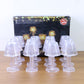 Live image of crystal style LED table lamp emitting warm light