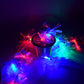 Hanging decorative fiber flower LED string lights creating ambient warm glow for outdoor events