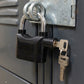 Safora Security Alarm Padlock securing a sturdy metal gate, demonstrating its anti-theft use.