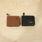 Live shot of man holding zip-around card holder wallet showing texture