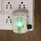 Angled view of compact electric mantra bell with glowing LED light