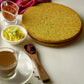 Close-up of a crispy round Indian snack, emphasizing its thinness.